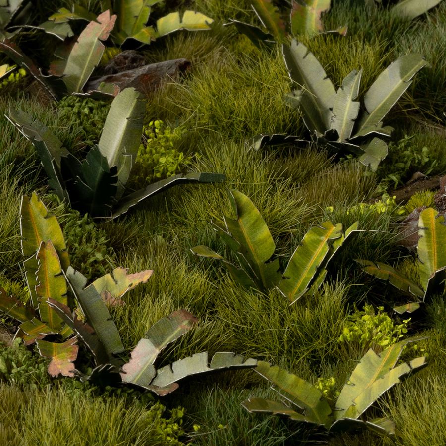 Miniature terrain featuring assembled Banana Tree laser-cut plants integrated into a realistic scenic landscape.