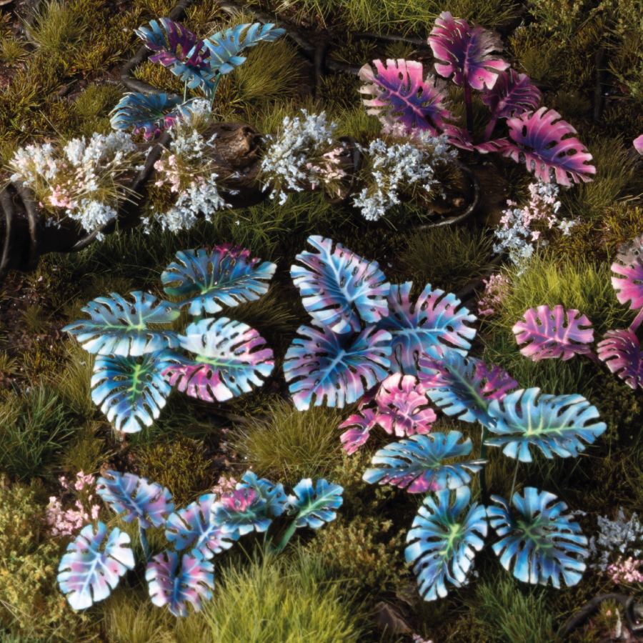 Miniature terrain featuring assembled Alien Monstera laser-cut plants integrated into a realistic scenic landscape.