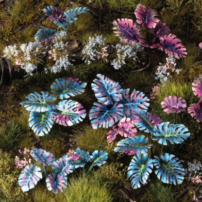 Miniature terrain featuring assembled Alien Monstera laser-cut plants integrated into a realistic scenic landscape.