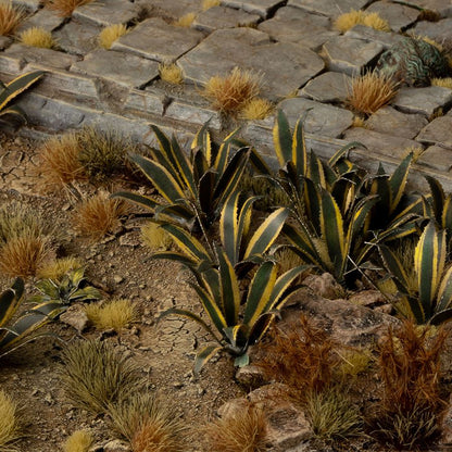 Miniature terrain featuring assembled Agave laser-cut plants integrated into a realistic scenic landscape.