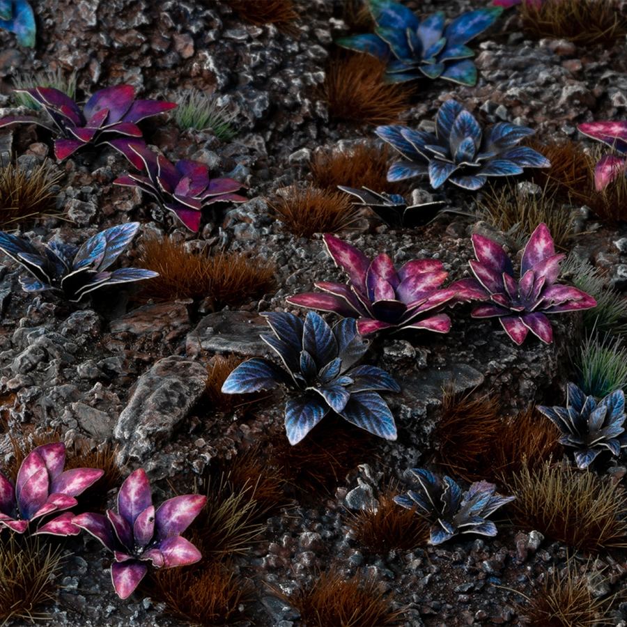 Miniature terrain featuring assembled Alien Rosette laser-cut plants integrated into a realistic scenic landscape.