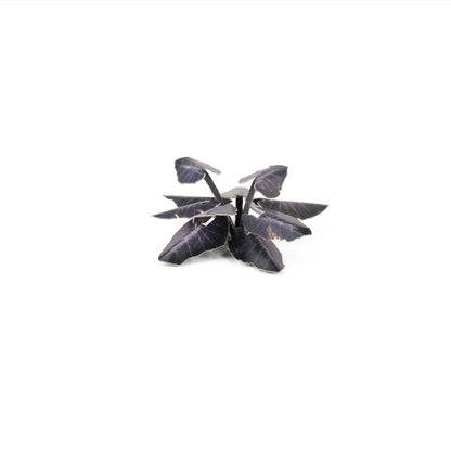 Miniature terrain featuring assembled Black Magic Taro laser-cut plants integrated into a realistic scenic landscape.