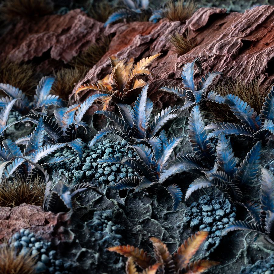 Miniature terrain featuring assembled Alien Fern laser-cut plants integrated into a realistic scenic landscape.