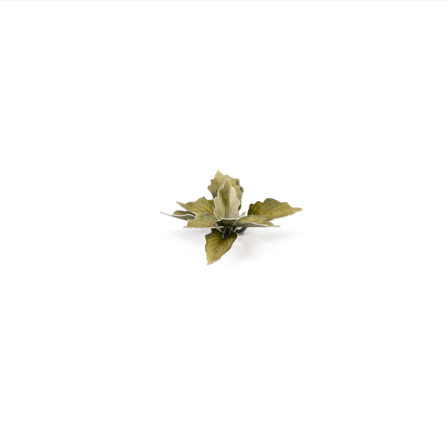 Miniature terrain featuring assembled Plantain Lily laser-cut plants integrated into a realistic scenic landscape.