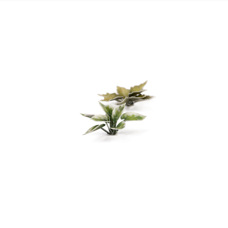 Miniature terrain featuring assembled Plantain Lily laser-cut plants integrated into a realistic scenic landscape.