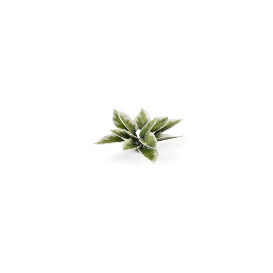 Miniature terrain featuring assembled Plantain Lily laser-cut plants integrated into a realistic scenic landscape.